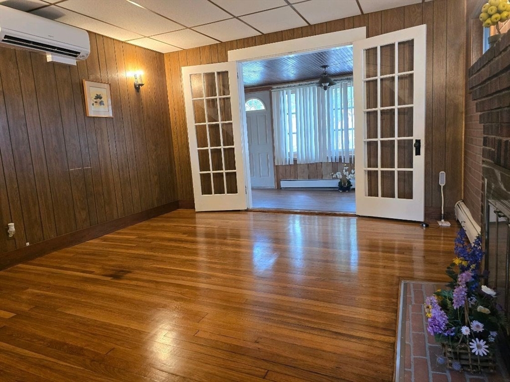 43 Shore Avenue Wareham, MA 02571 - Photo 13 of 32 an empty room with wooden floor and windows