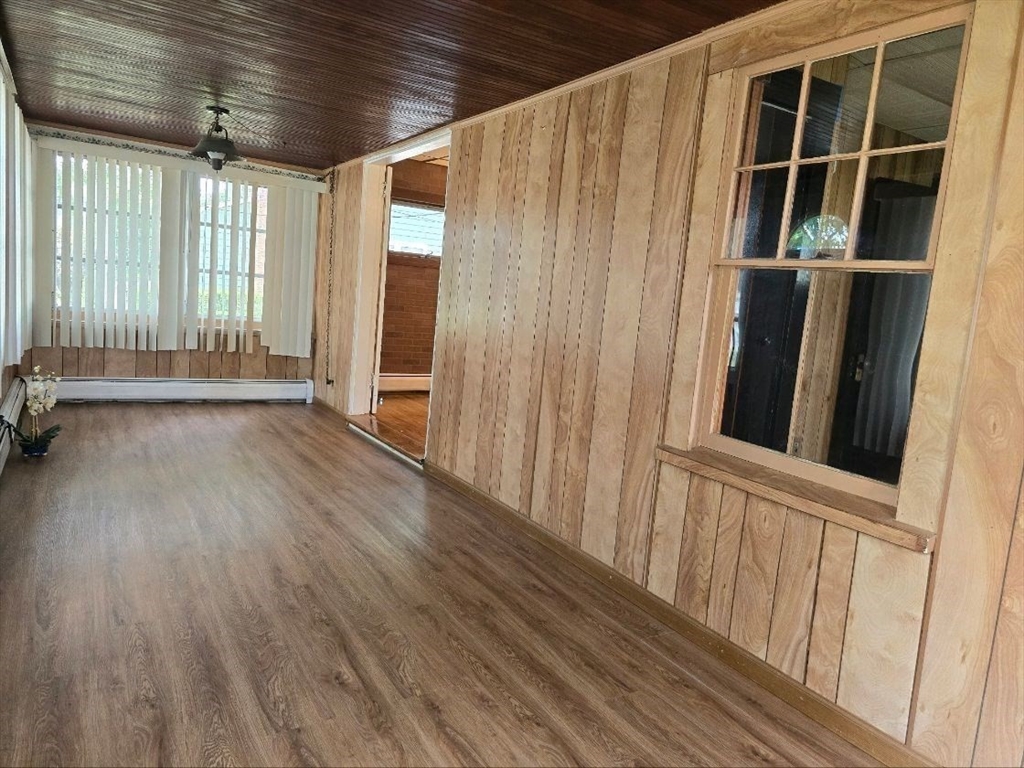 43 Shore Avenue Wareham, MA 02571 - Photo 10 of 32 a view of an empty room with wooden floor and a window