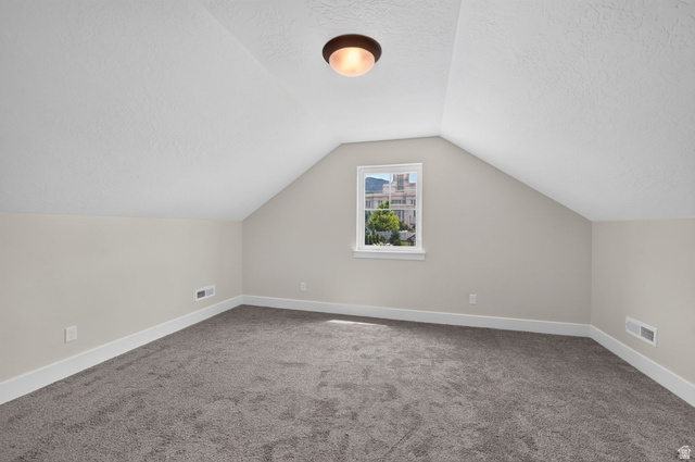 1002 West Temple Rim Lane Payson, UT 84651 - Photo 42 of 68 Carpeted room featuring sloped ceilings and a single window with white trim