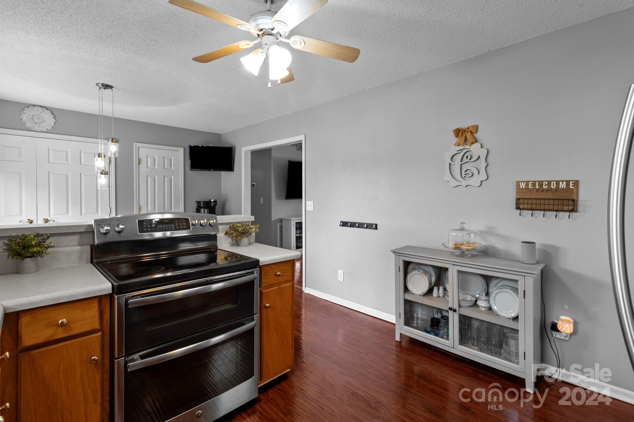 747 Sides Road Salisbury, NC 28146 - Photo 12 of 21 a kitchen with stainless steel appliances a stove and a bookshelf