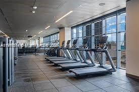 159 Northeast 6th Street, Unit 2807 Miami, FL 33132 - Photo 10 of 13 a view of a room with gym equipment
