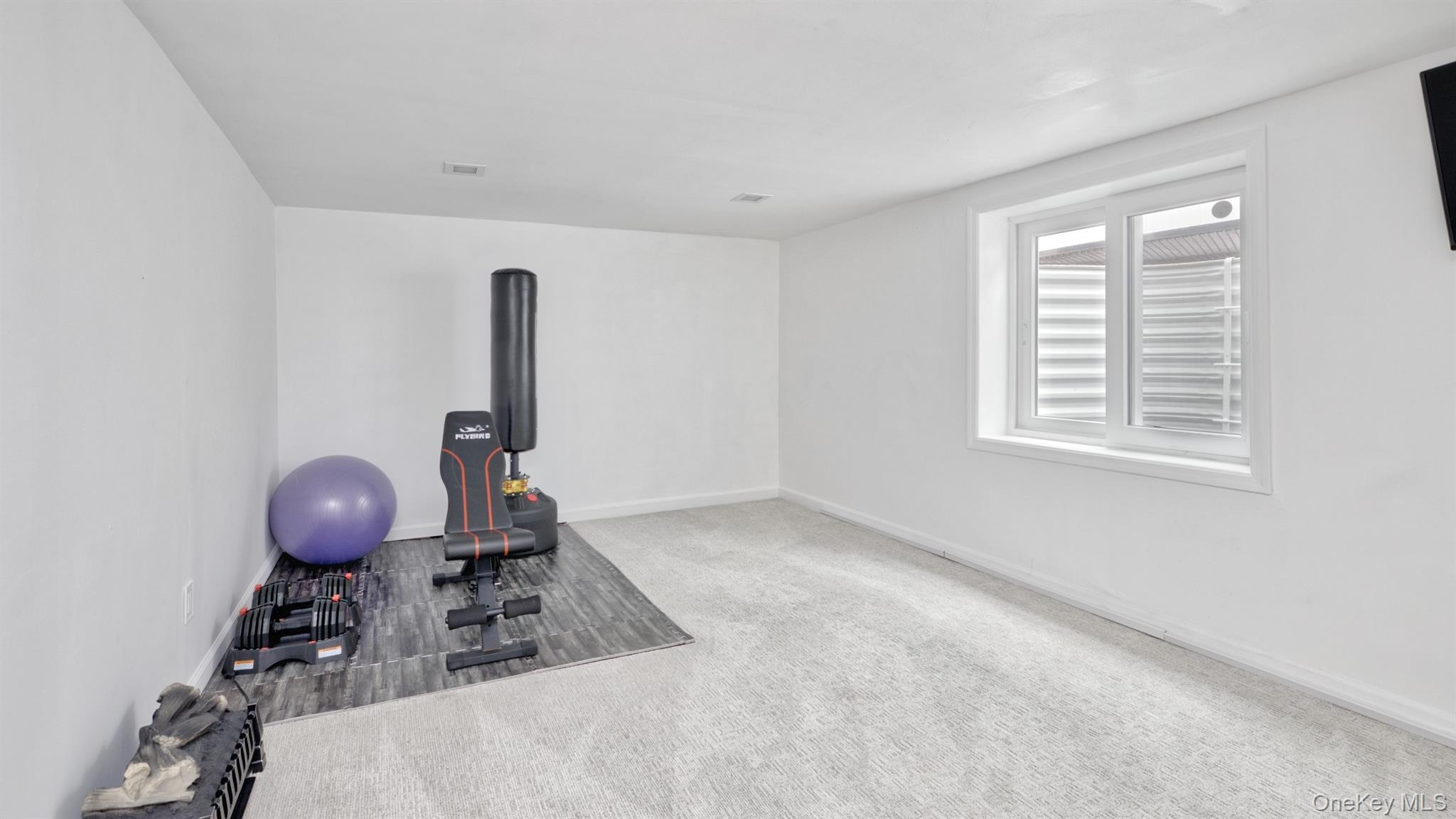 383 White Road Mineola, NY 11501 - Photo 14 of 21 a room with furniture and window