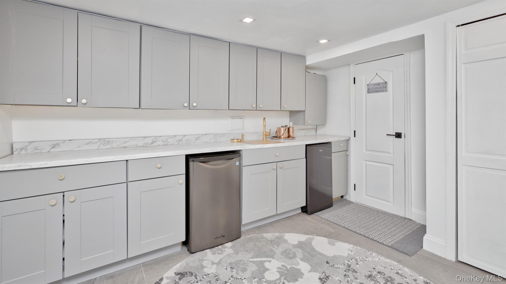 383 White Road Mineola, NY 11501 - Photo 15 of 21 a kitchen with white cabinets