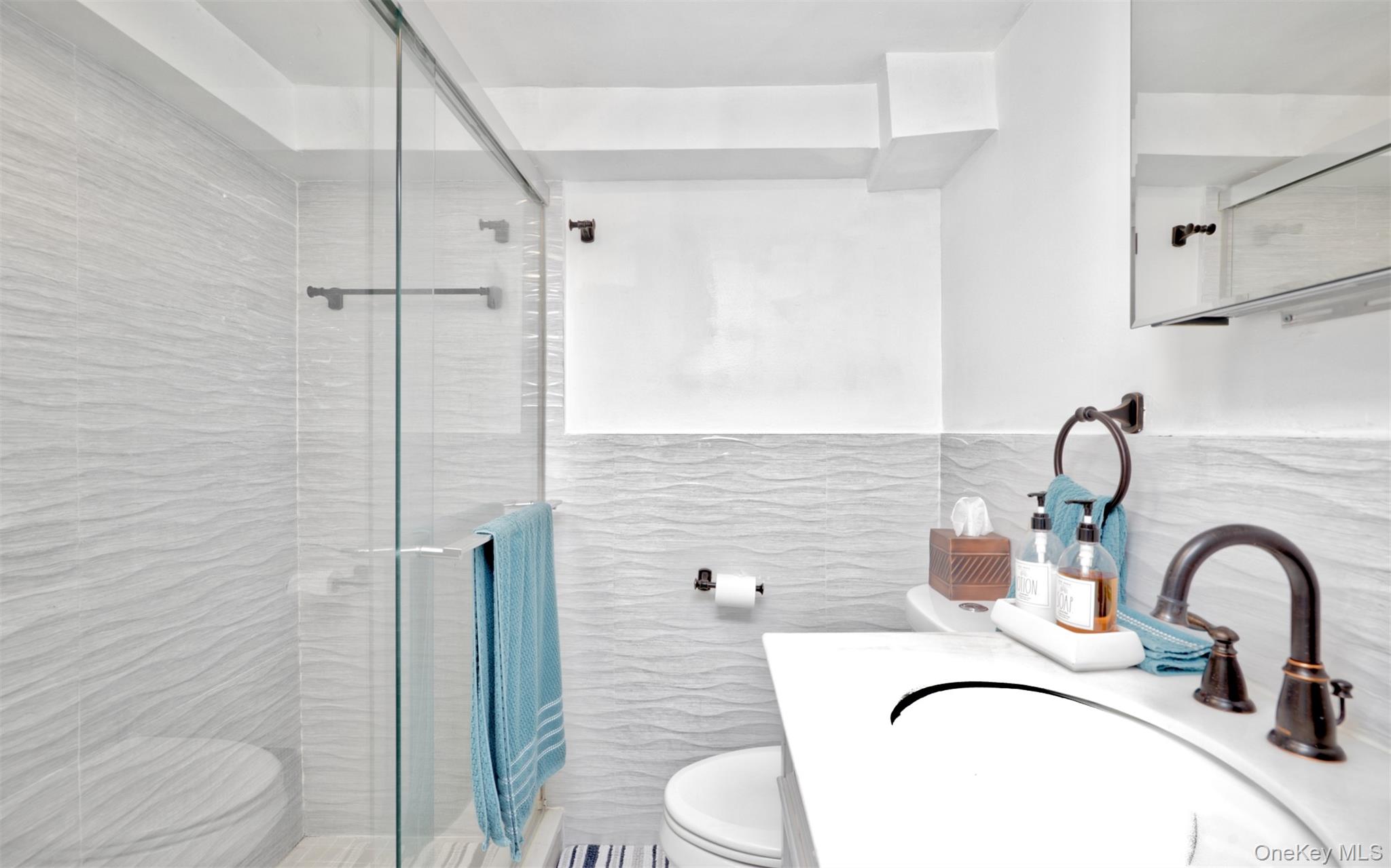 383 White Road Mineola, NY 11501 - Photo 17 of 21 a bathroom with a sink toilet and shower