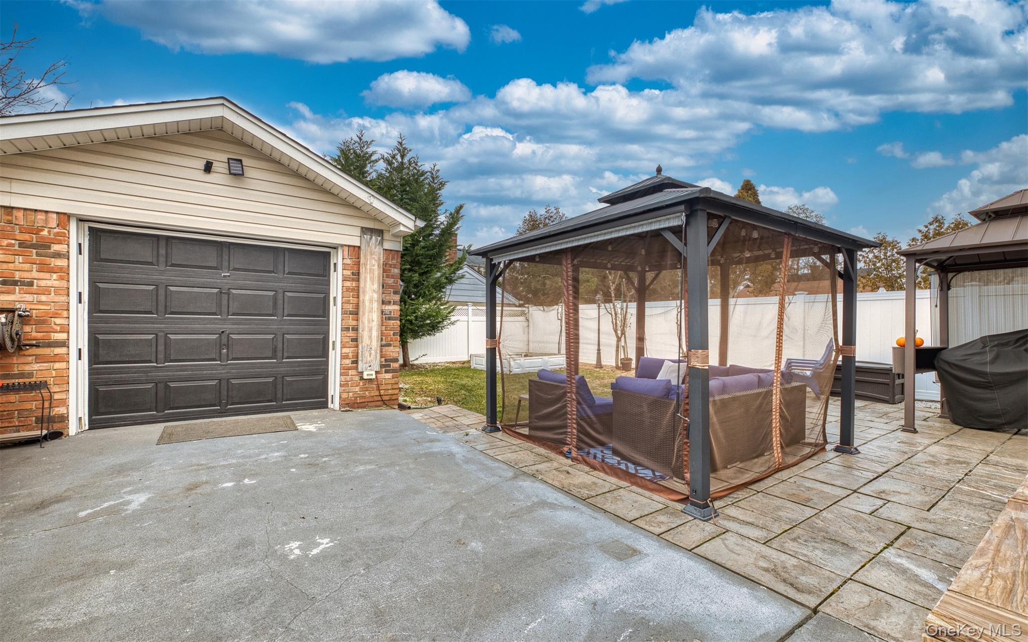 383 White Road Mineola, NY 11501 - Photo 18 of 21 a front view of a house with parking space