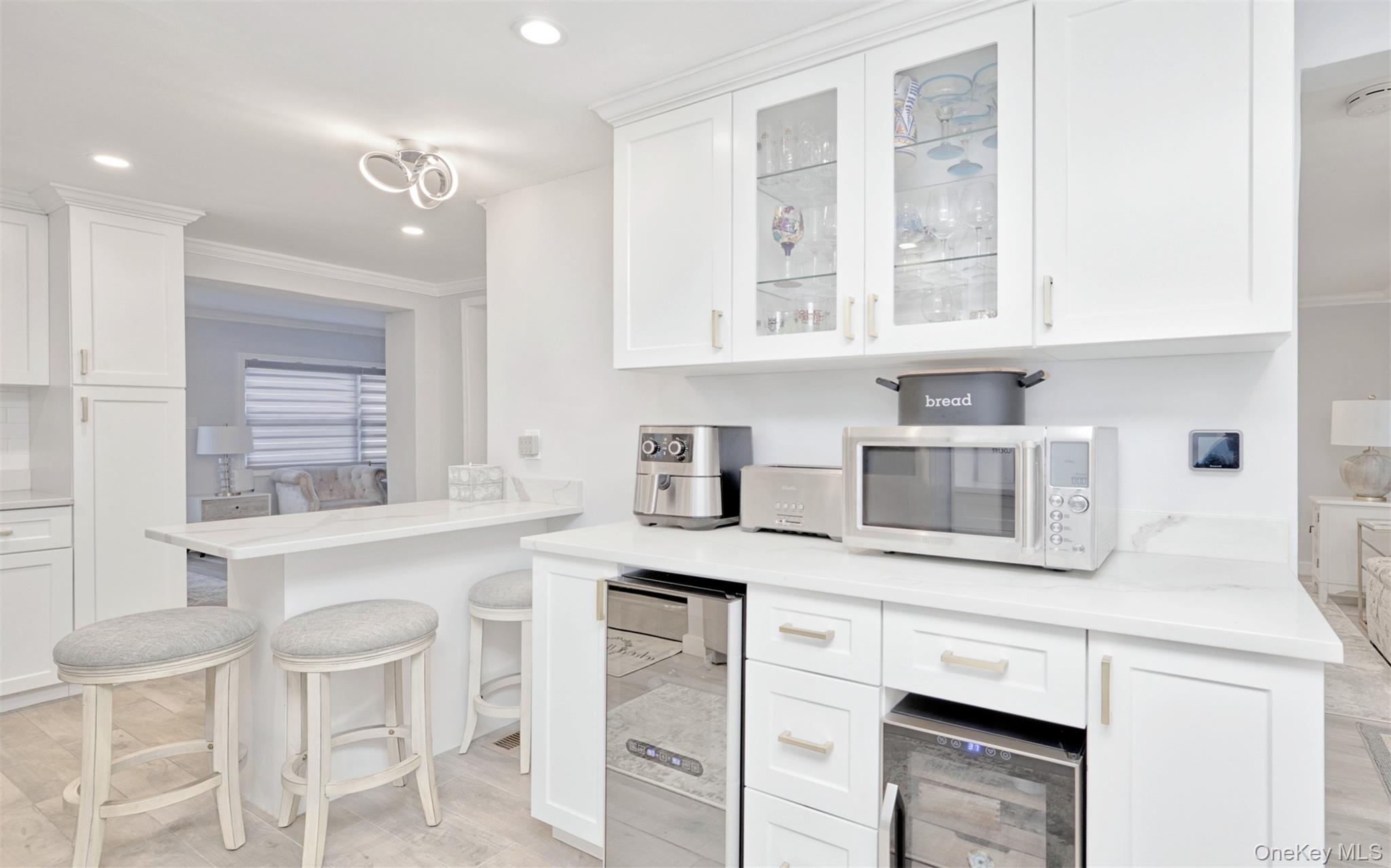 383 White Road Mineola, NY 11501 - Photo 6 of 21 a kitchen with stainless steel appliances granite countertop white cabinets and a granite counter tops