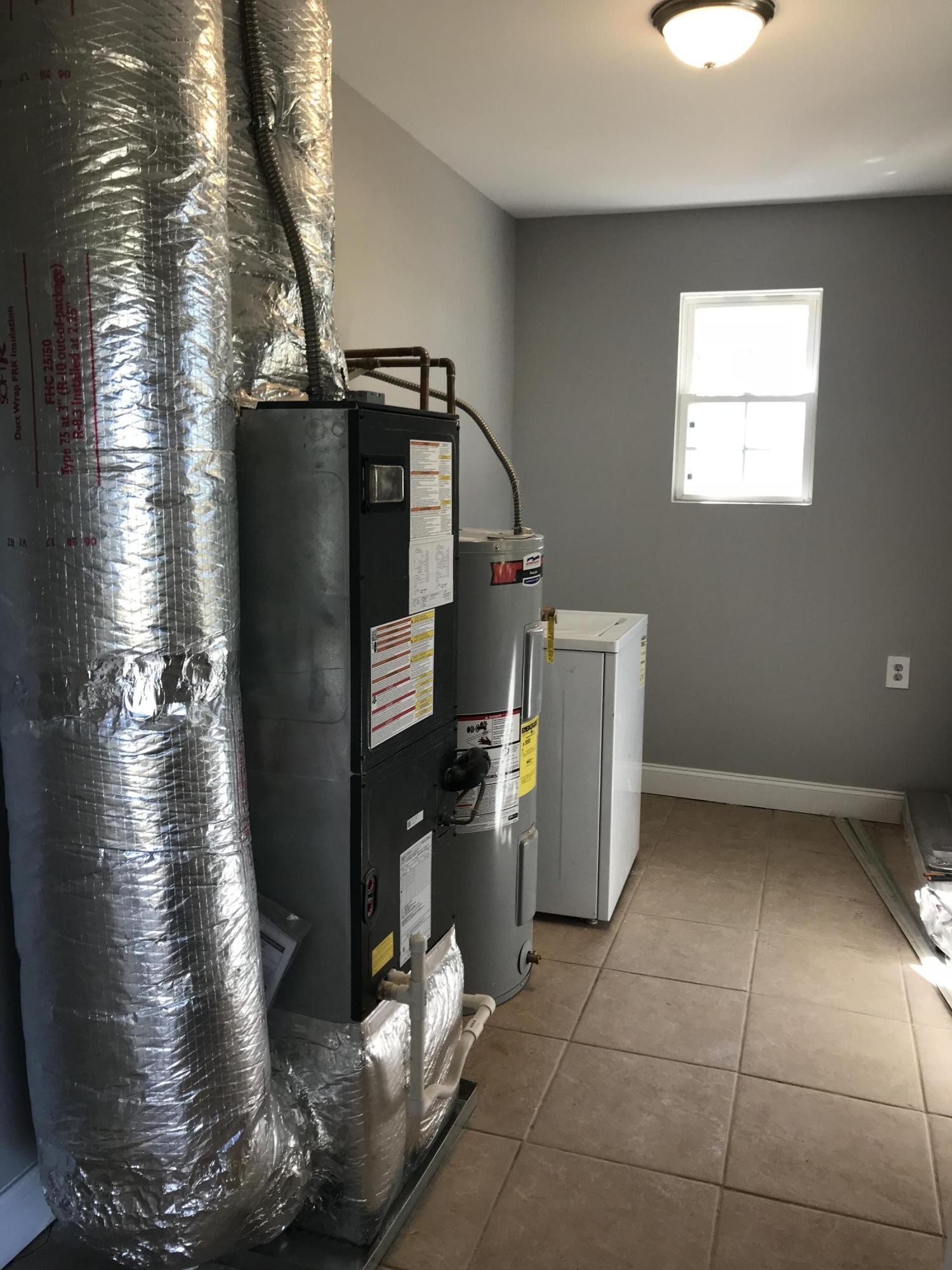 4402 Morganton Road Maryville, TN 37801 - Photo 26 of 28 a water heater sitting inside of a kitchen