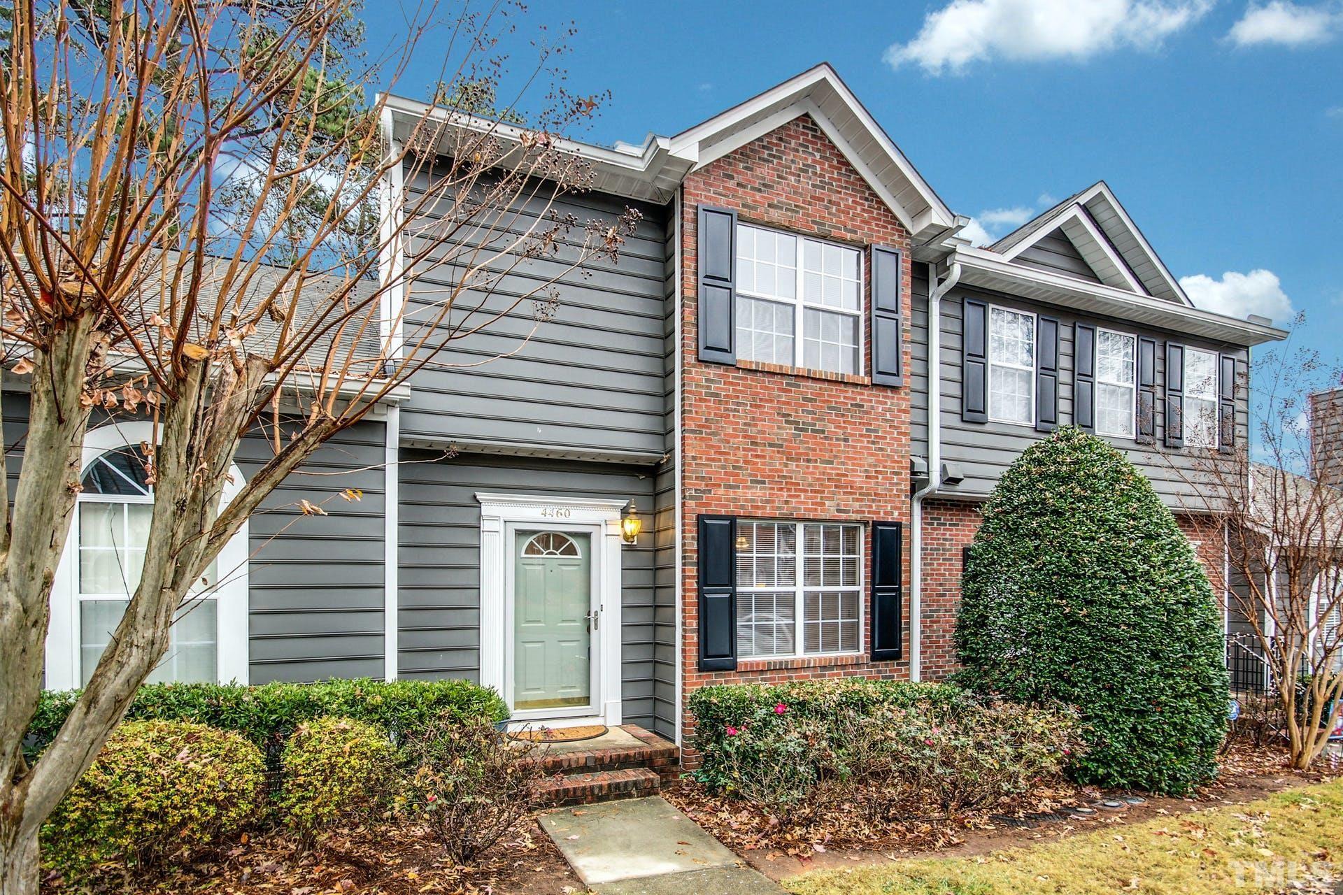 4460 Still Pines Drive Raleigh, NC 27613 - Photo 1 of 14 front view of a house with a garden