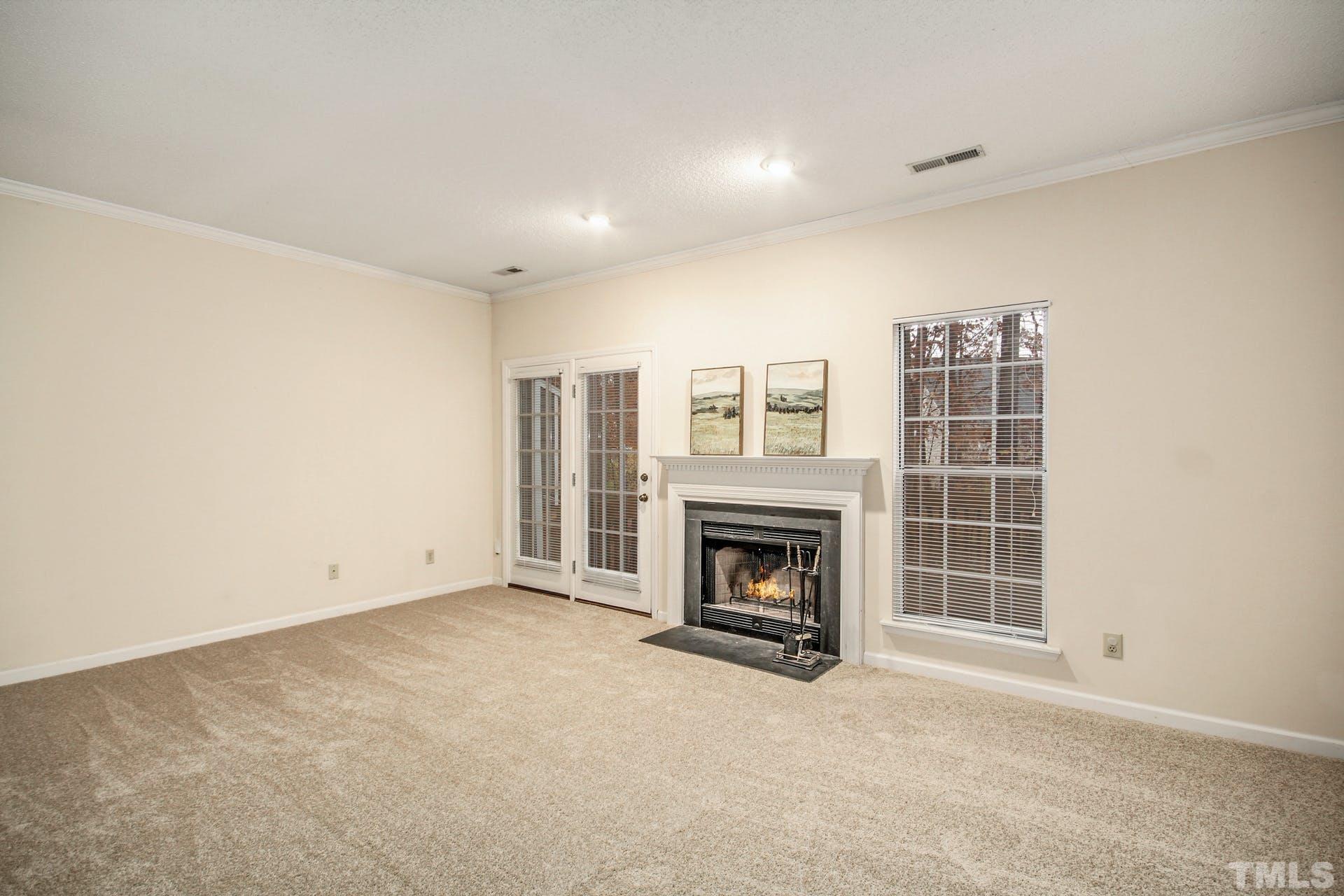 4460 Still Pines Drive Raleigh, NC 27613 - Photo 3 of 14 a view of empty room with a fireplace