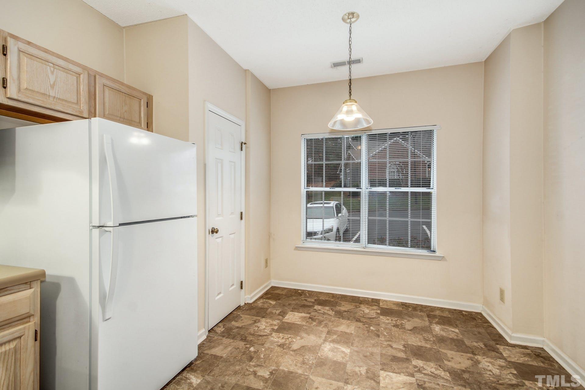 4460 Still Pines Drive Raleigh, NC 27613 - Photo 6 of 14 a view of an empty room with a window