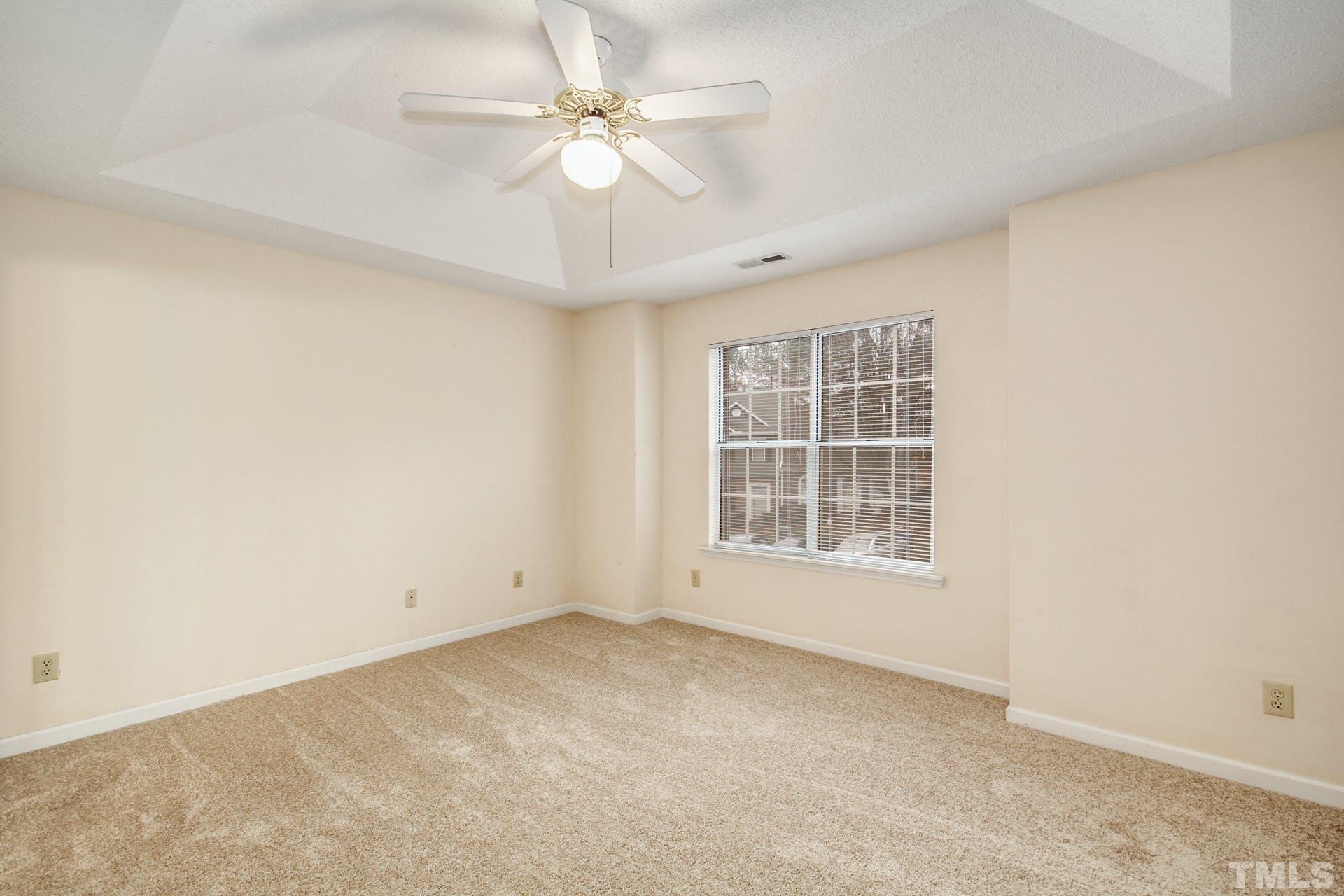 4460 Still Pines Drive Raleigh, NC 27613 - Photo 10 of 14 an empty room with a window