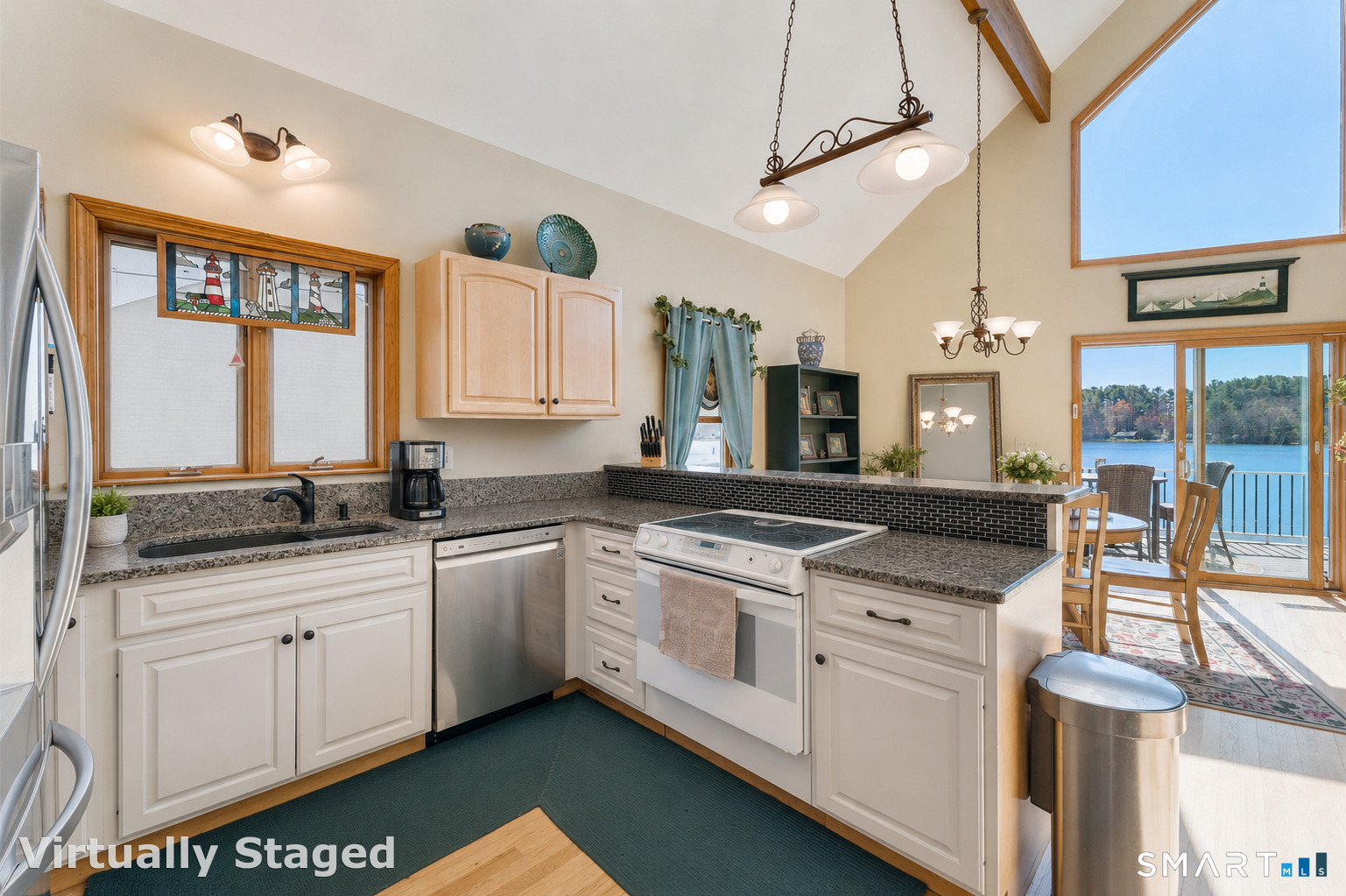 9 Becola Road Thompson, CT 06277 - Photo 8 of 30 a large kitchen with stainless steel appliances granite countertop a stove and a sink