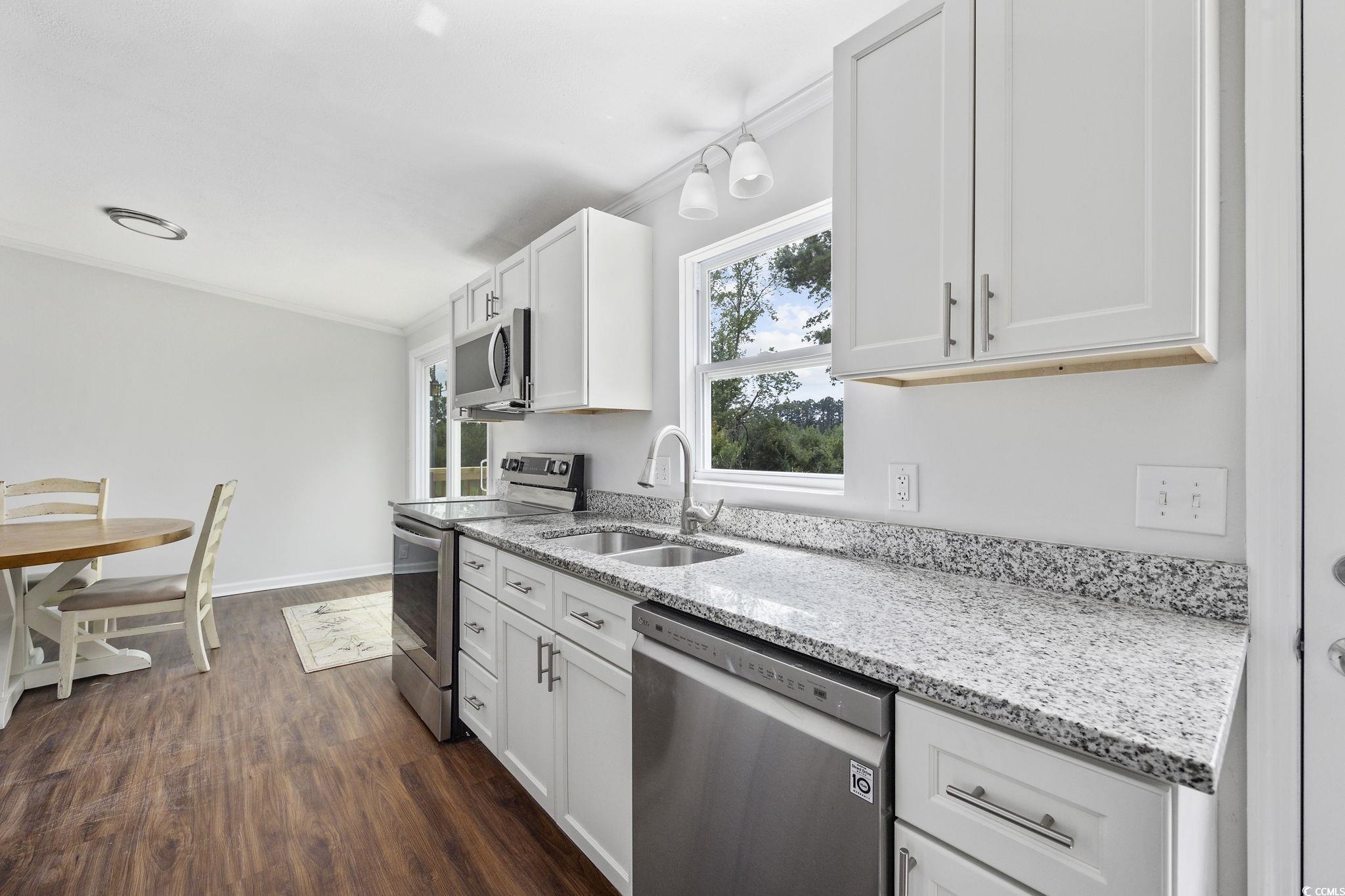 301 Duck Cove Road Conway, SC 29526 - Photo 14 of 25 Dining space featuring ceiling fan, dark hardwood