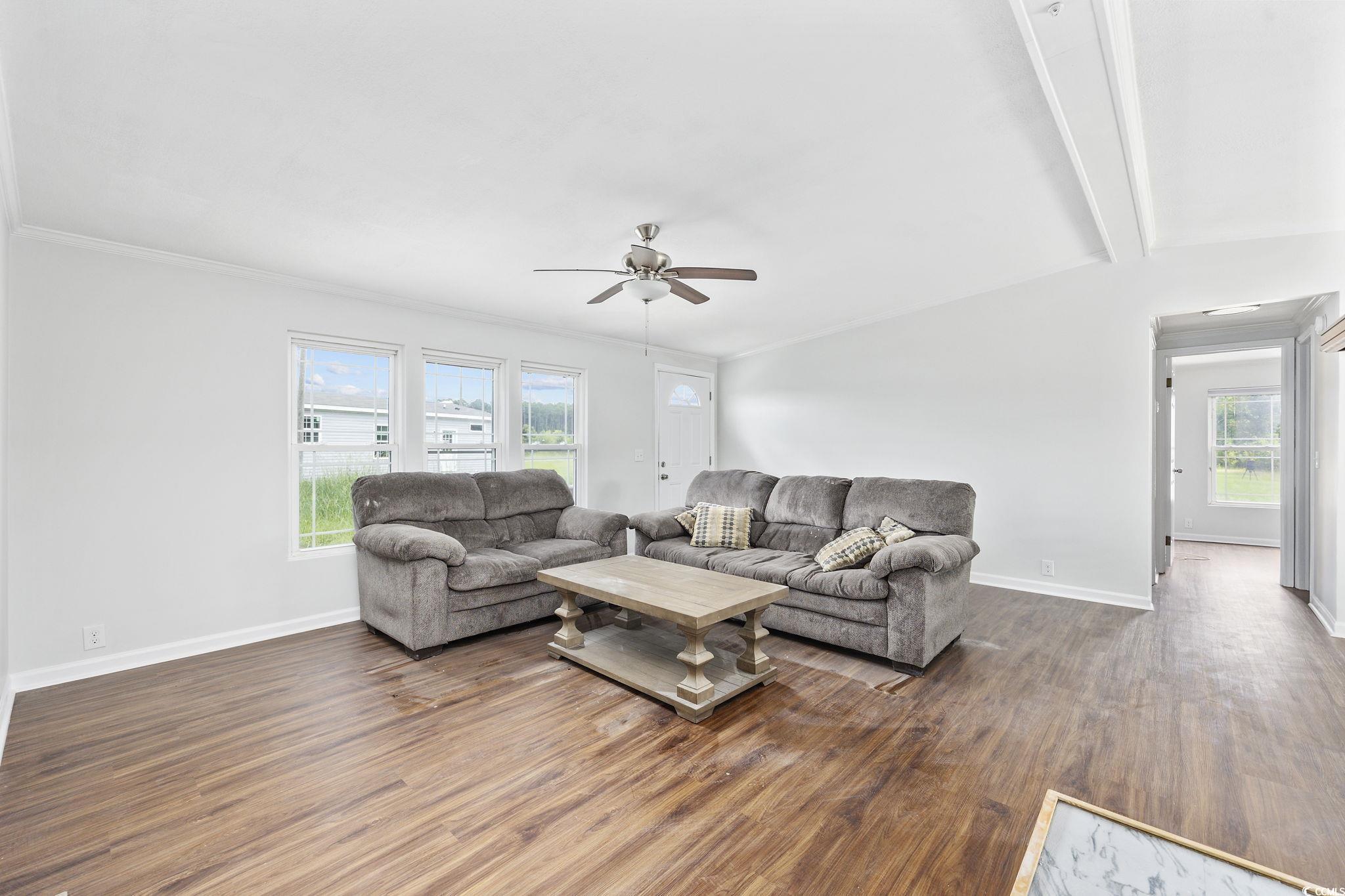 301 Duck Cove Road Conway, SC 29526 - Photo 6 of 25 Living room featuring crown molding, ceiling fan,