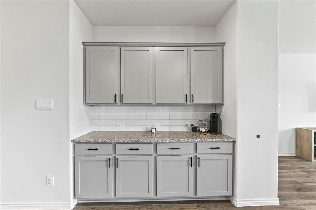 2920 Pinecrest Drive Aubrey, TX 76227 - Photo 10 of 27 a view of cabinets with washer and dryer