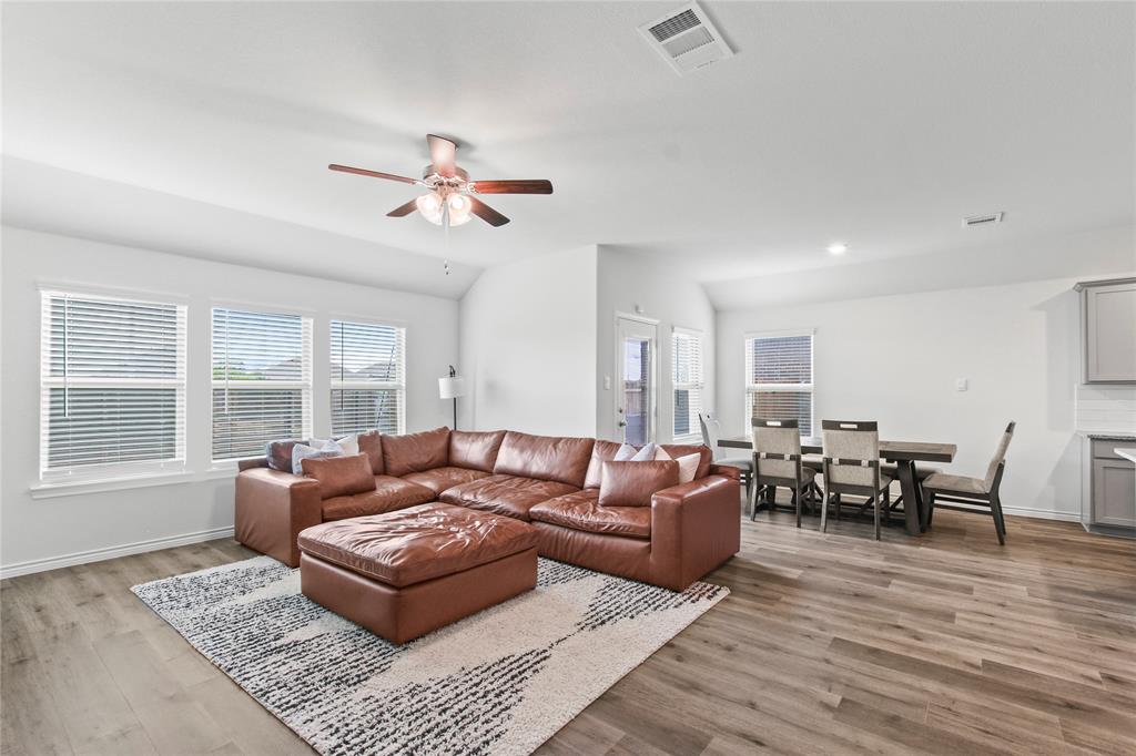 2920 Pinecrest Drive Aubrey, TX 76227 - Photo 12 of 27 a living room with furniture ceiling fan and a window