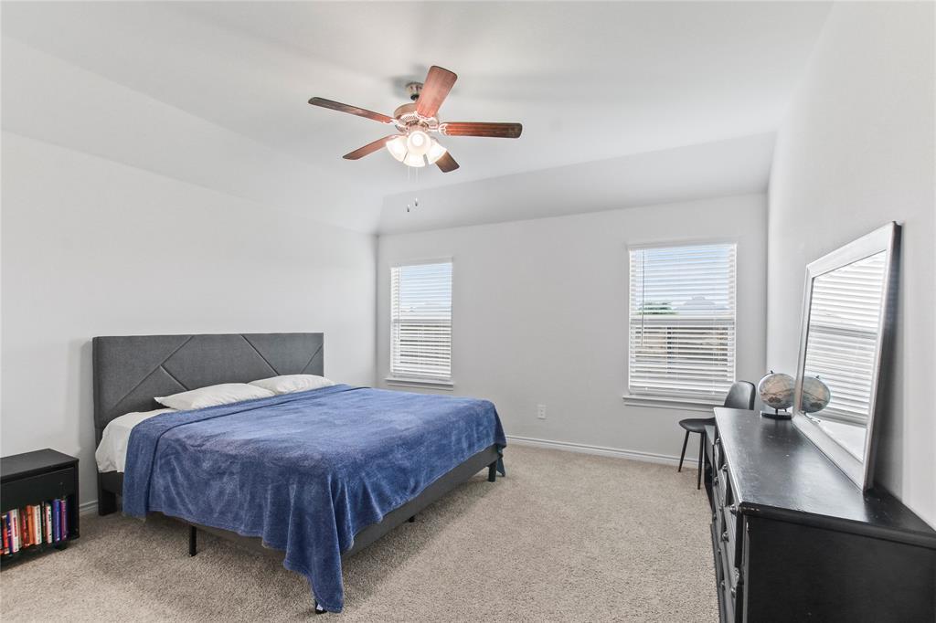 2920 Pinecrest Drive Aubrey, TX 76227 - Photo 19 of 27 a bedroom with a large bed and a window