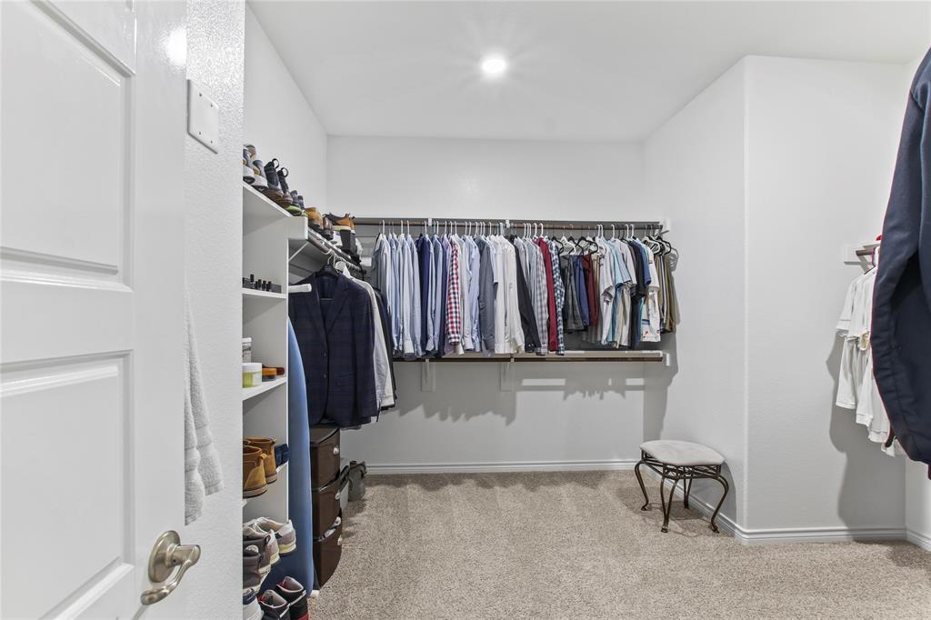 2920 Pinecrest Drive Aubrey, TX 76227 - Photo 23 of 27 a view of walk in closet with clothes and shoes