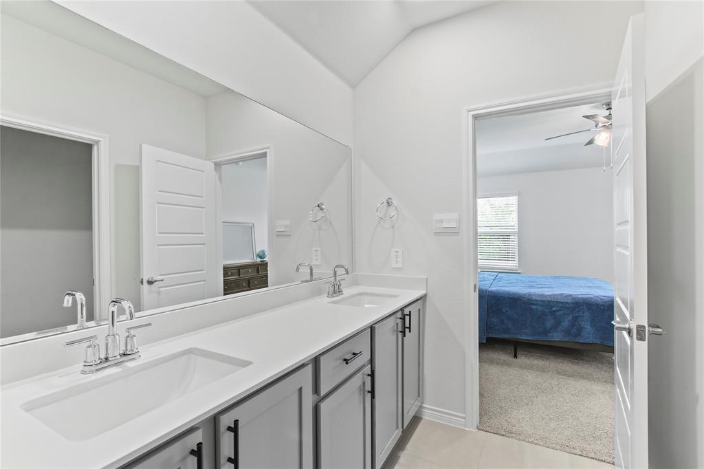 2920 Pinecrest Drive Aubrey, TX 76227 - Photo 24 of 27 a bathroom with a sink double vanity and a mirror