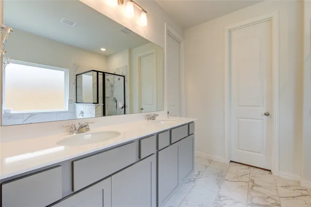 a bathroom with a bathtub and a sink