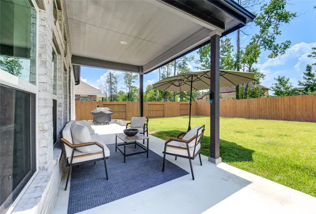 a patio with table and chairs