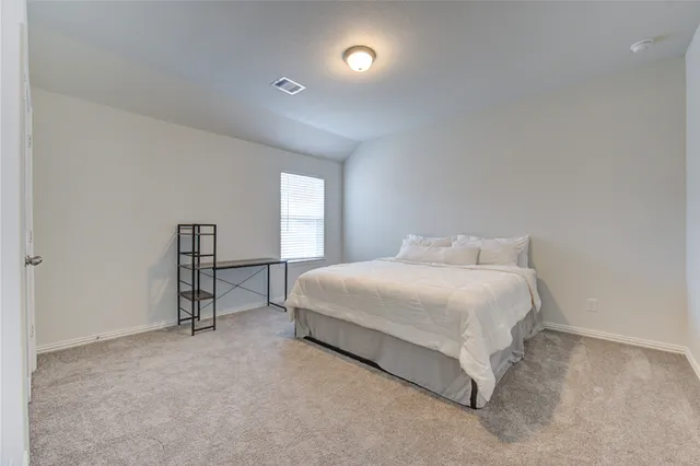 a view of a livingroom with furniture and a ceiling fan