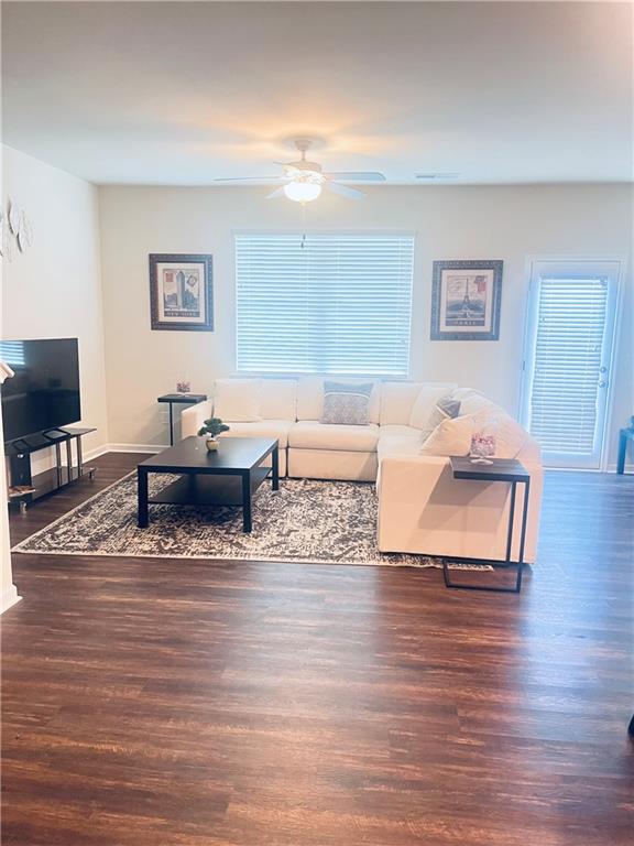 300 Harrison Street Calhoun, GA 30701 - Photo 3 of 17 a living room with furniture and a wooden floor