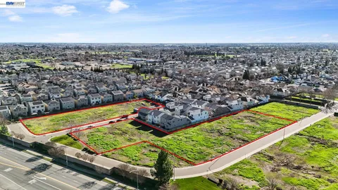a view of a yard with a city view