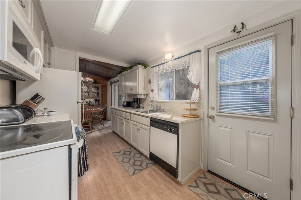 15885 Bottle Rock Road Middletown, CA 95461 - Photo 12 of 38 a kitchen with granite countertop a sink stove and cabinets
