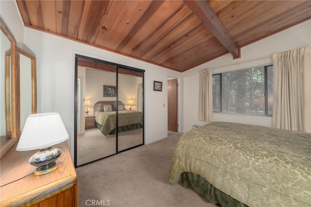 15885 Bottle Rock Road Middletown, CA 95461 - Photo 19 of 38 a bedroom with a bed and large window