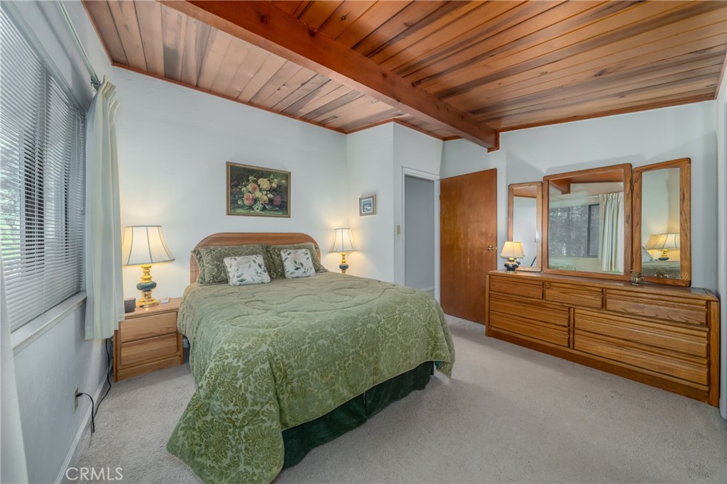 15885 Bottle Rock Road Middletown, CA 95461 - Photo 21 of 38 a spacious bedroom with a bed and window
