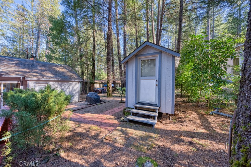 15885 Bottle Rock Road Middletown, CA 95461 - Photo 28 of 38 a view of backyard with a barn and a cactus plant
