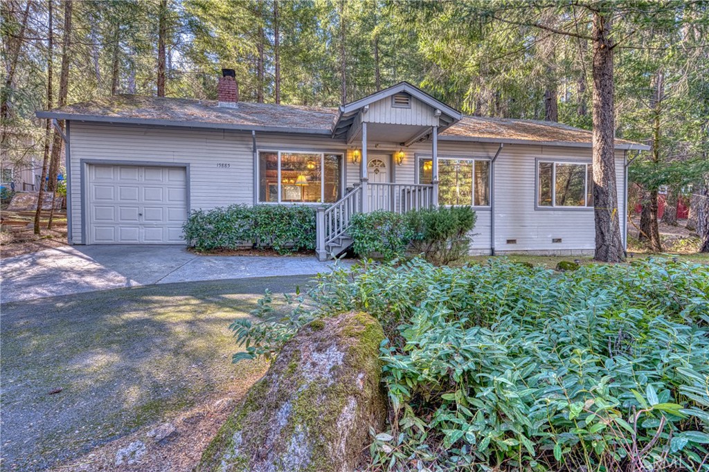 15885 Bottle Rock Road Middletown, CA 95461 - Photo 4 of 38 a front view of a house with a garden