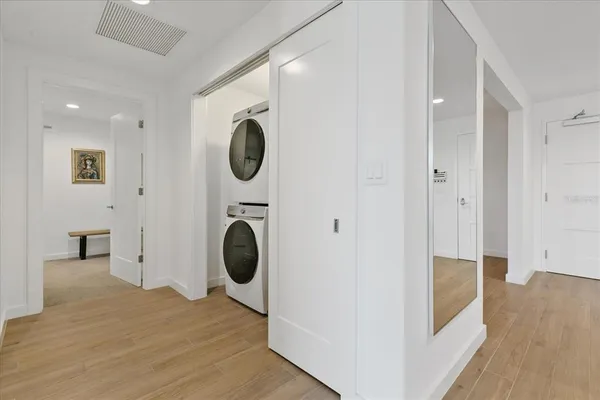 a view of a hallway with washer and dryer