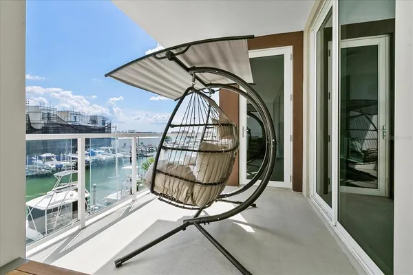 a view of staircase with a floor to ceiling window and entryway