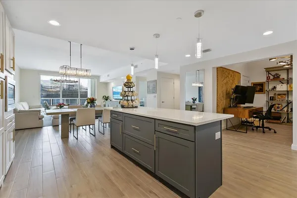 a kitchen with a sink a counter top space and appliances