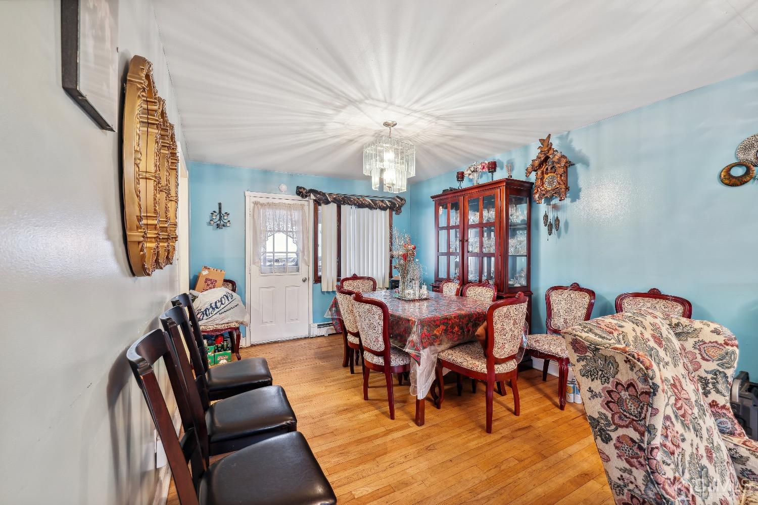 1096 Rudyard Drive Perth Amboy, NJ 08861 - Photo 6 of 10 a view of a dining room with furniture and chandelier