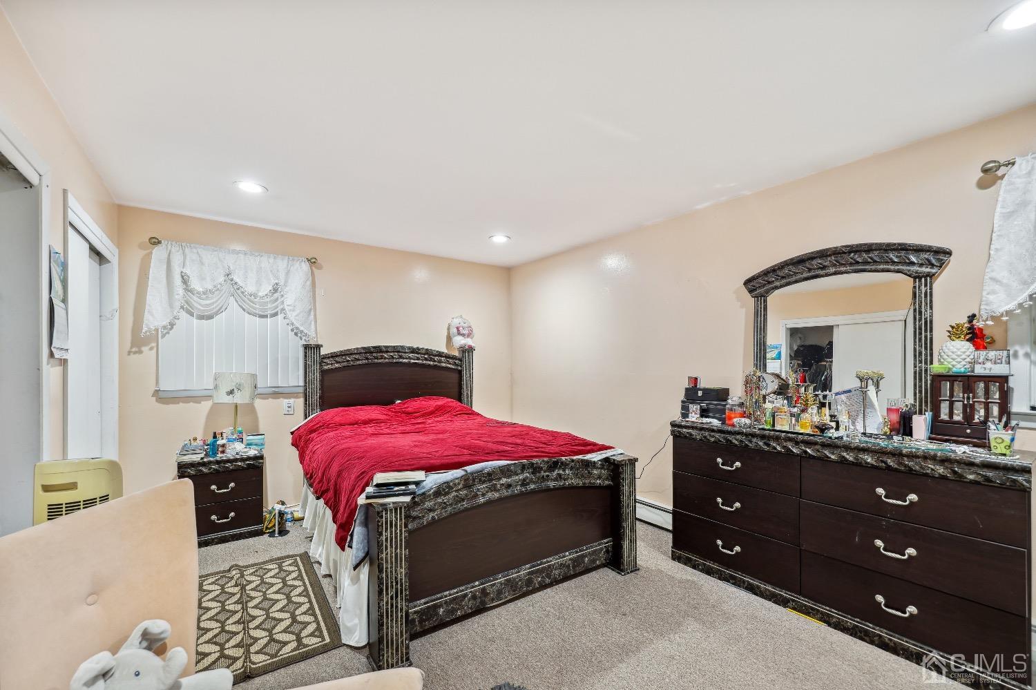 1096 Rudyard Drive Perth Amboy, NJ 08861 - Photo 10 of 10 a bedroom with a bed and a dresser