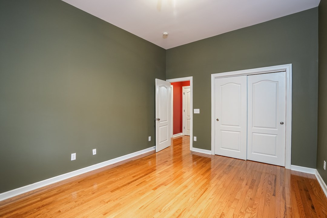 2920 Elmfield Street Raleigh, NC 27614 - Photo 15 of 30 The main floor guest bedroom has a double window overlooking the back yard, a double closet, and hardwood floors. A pocket door from the family room closes off the bedroom and bathroom making it a true guest suite. Bedroom 5