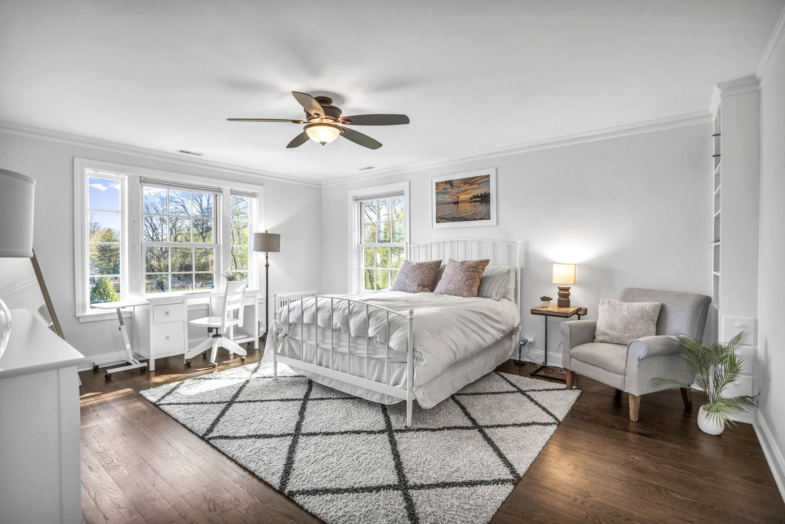 2120 Middlefork Road Northfield, IL 60093 - Photo 23 of 44 a spacious bedroom with a bed a couch and a window
