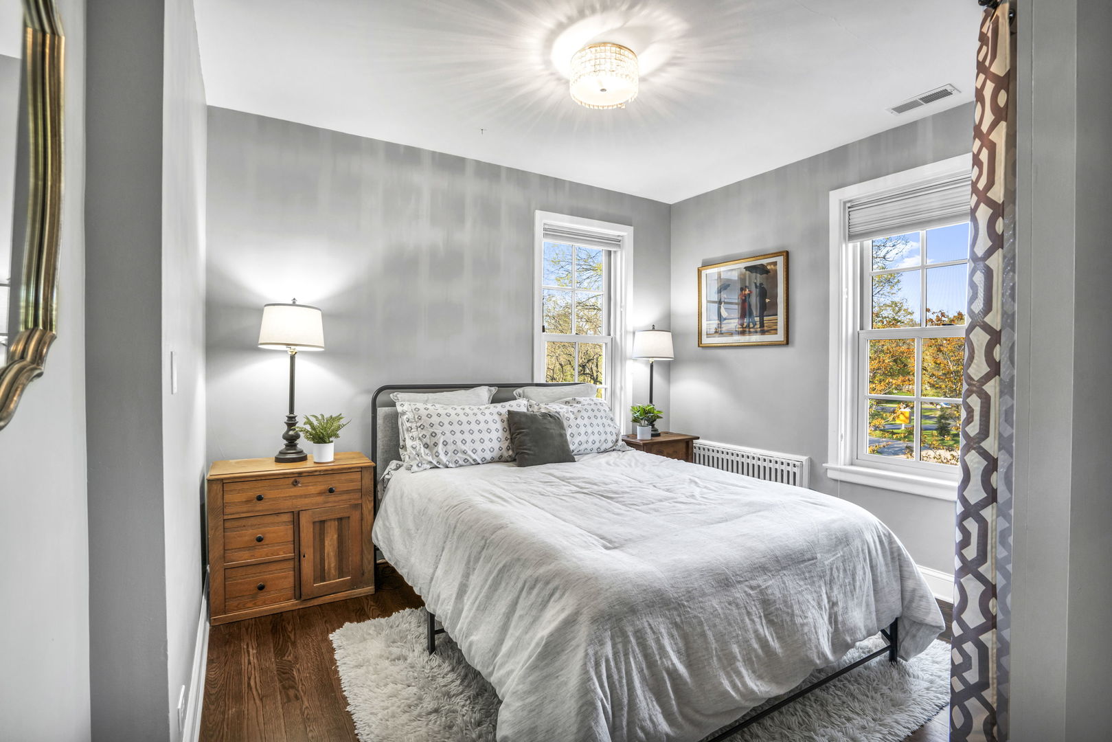 2120 Middlefork Road Northfield, IL 60093 - Photo 27 of 44 a bedroom with a bed and a chandelier