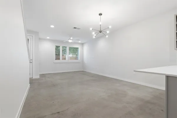 an empty room with a empty space and a window