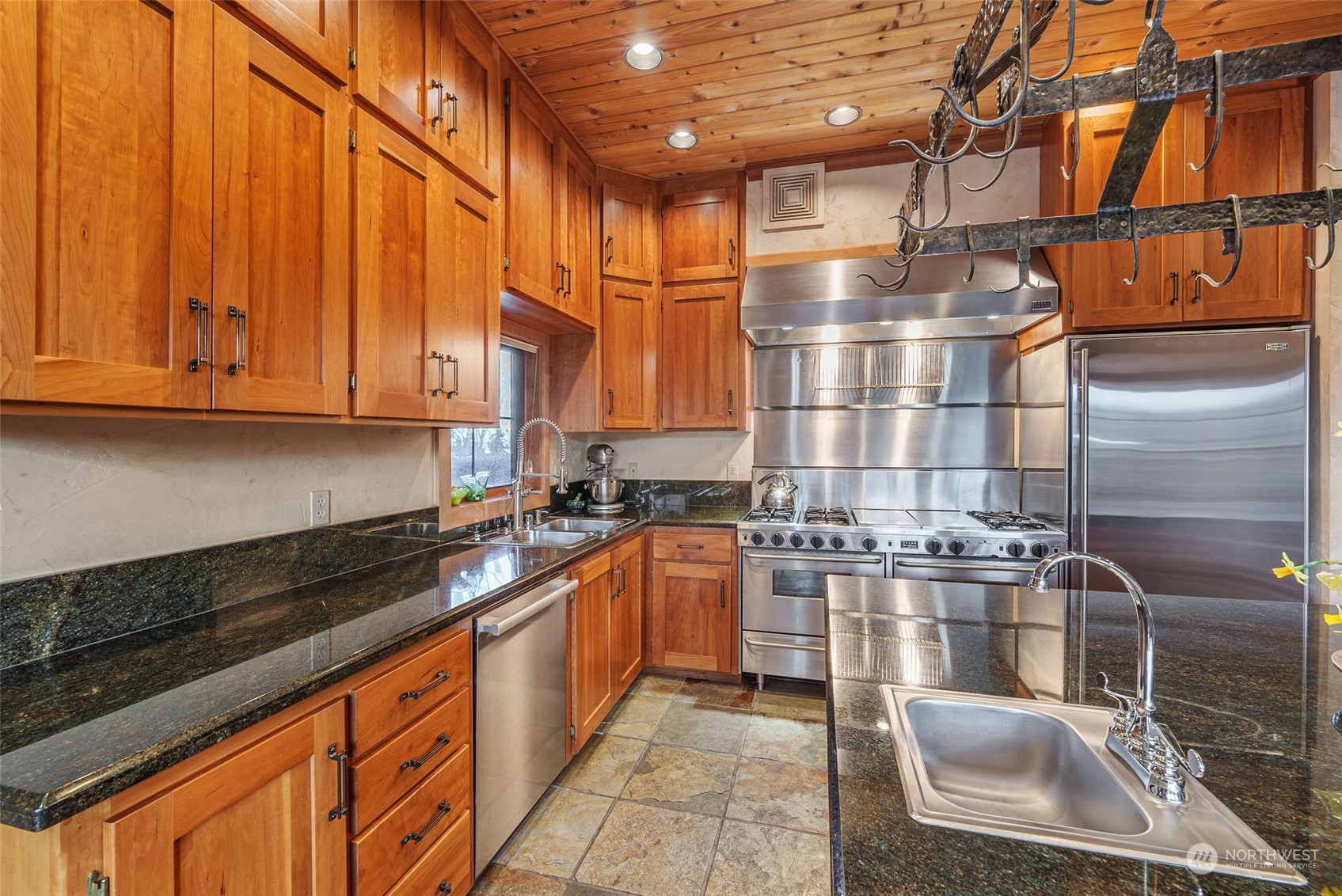 2325 Cays Road Sequim, WA 98382 - Photo 11 of 36 a kitchen with stainless steel appliances granite countertop a sink and cabinets