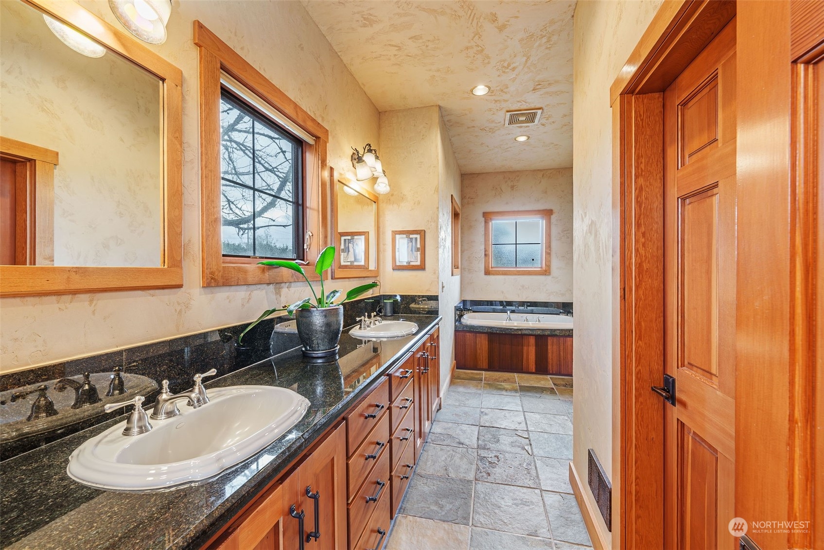 2325 Cays Road Sequim, WA 98382 - Photo 17 of 36 a bathroom with a granite countertop sink and a mirror