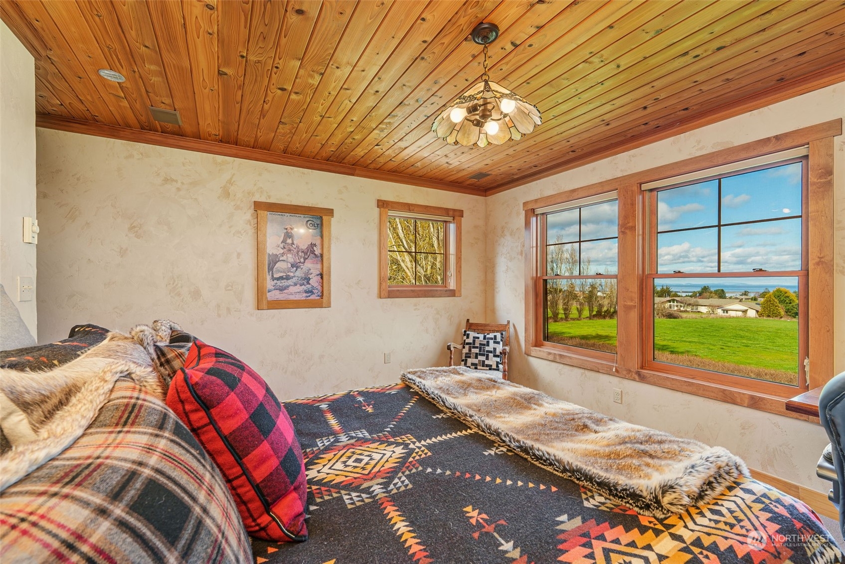 2325 Cays Road Sequim, WA 98382 - Photo 19 of 36 a bedroom with a bed and a large window