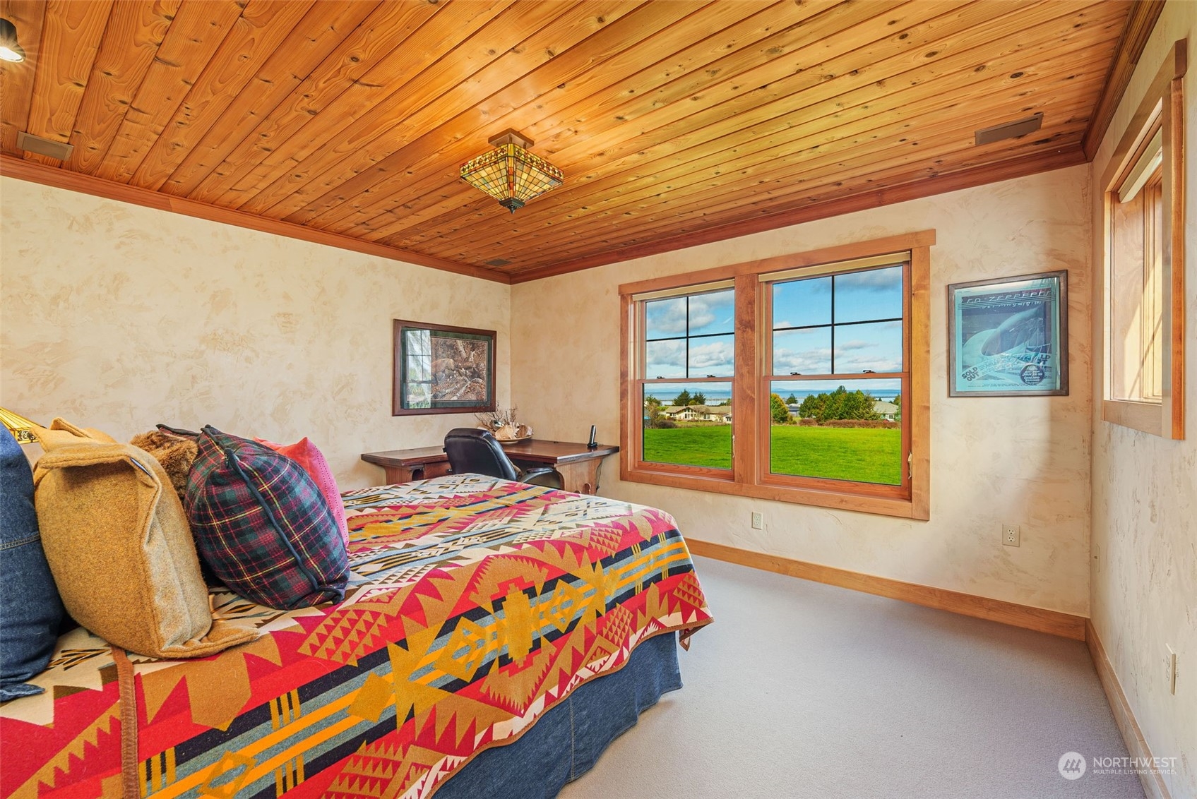 2325 Cays Road Sequim, WA 98382 - Photo 21 of 36 a bed sitting in a bedroom next to a window