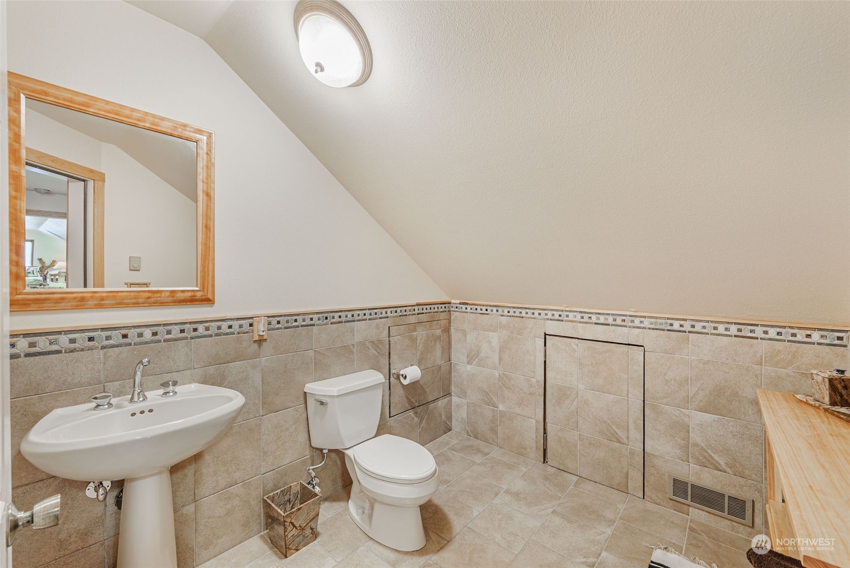 2325 Cays Road Sequim, WA 98382 - Photo 30 of 36 a bathroom with a toilet sink and mirror