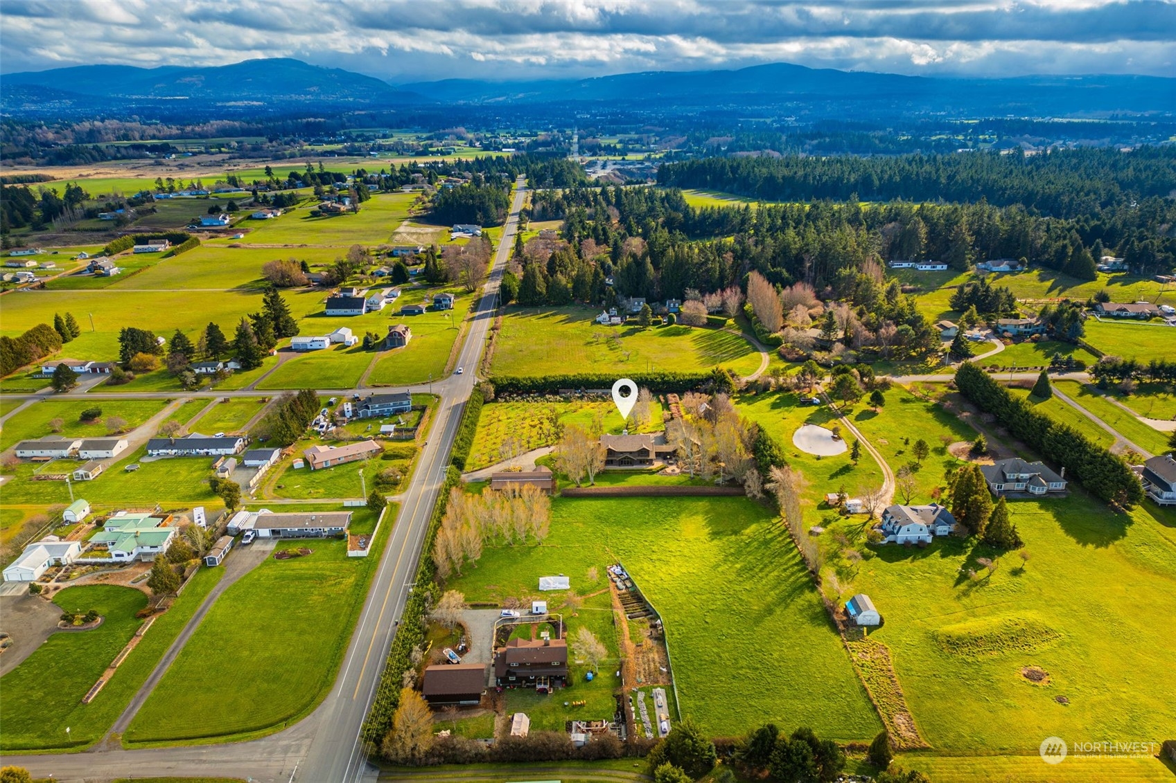 2325 Cays Road Sequim, WA 98382 - Photo 33 of 36 an aerial view of a pool with a yard