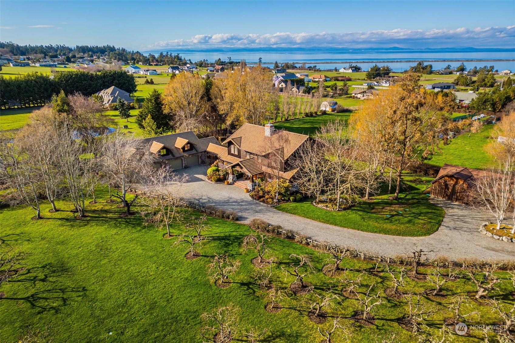 2325 Cays Road Sequim, WA 98382 - Photo 35 of 36 a view of a lake with a yard