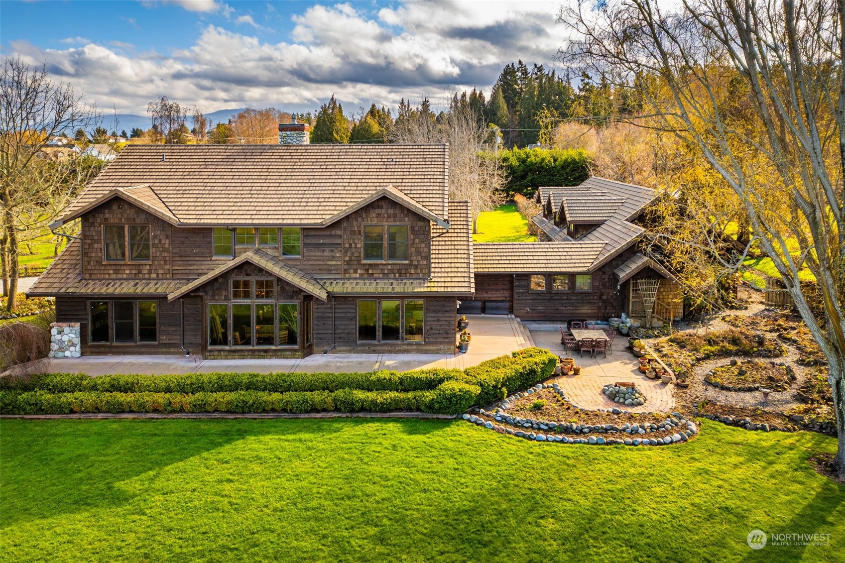 2325 Cays Road Sequim, WA 98382 - Photo 5 of 36 a view of a house with a big yard and potted plants